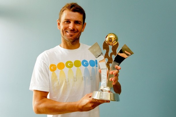 Mardy Fish z lovoriko, ki pripada zmagovalcu ameriške turneje turnirjev pred OP ZDA