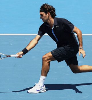 Federer na ogrevanju ni imel težav z Moyo