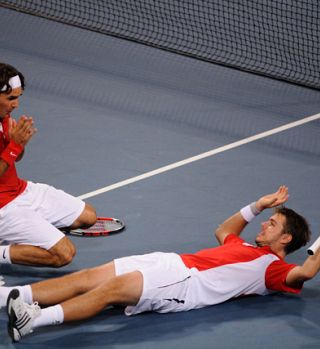Rogerju Federerju zlata medalja kot obliž na letošnje rane